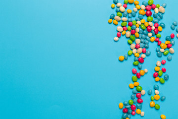colored candies on blue background