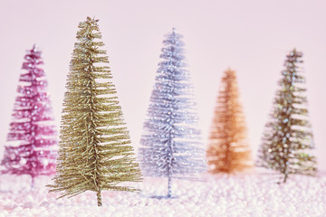 Retro stylized picture of miniature Christmas trees, selective focus.
