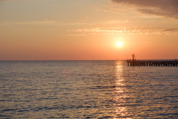 Fototapeta na wymiar Sunset on the black sea view on pearce