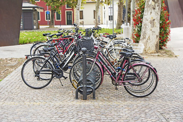Fototapeta na wymiar Bicycles parked on street in city