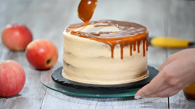Delicious apple cake decorating with homemade caramel sauce.