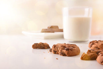 Biscuits with chocolate on white table front golden front