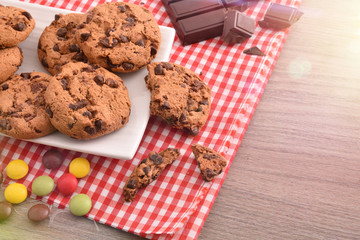 Breakfast with round biscuits with black chocolate top elevated