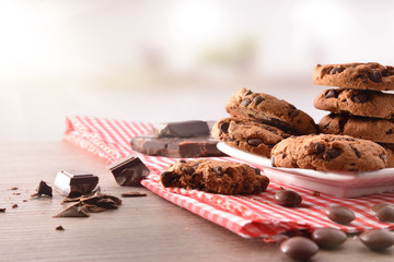 Round biscuits with black chocolate in kitchen front view