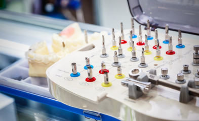 various samples of casts of dentures and tools for their handling, close up