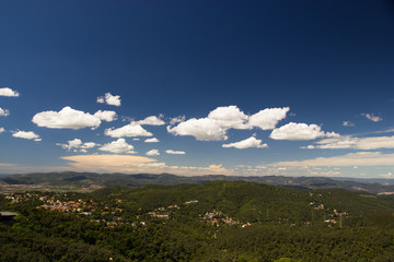 View on mountains and green forest from Tibidabo hill in Barcelona, Spain