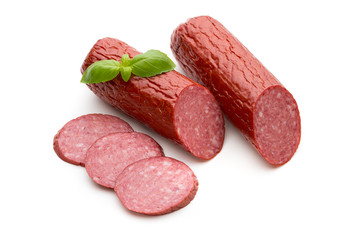 Salami smoked sausage, basil leaves on white background cutout.