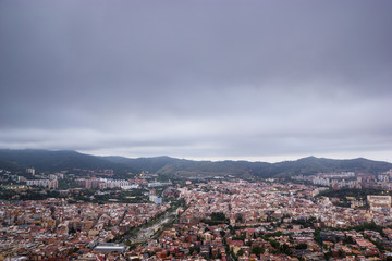 Cloudy view on Barcelona city from the mountain