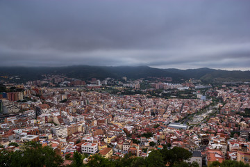 Fototapeta na wymiar Cloudy view on Barcelona city from the mountain