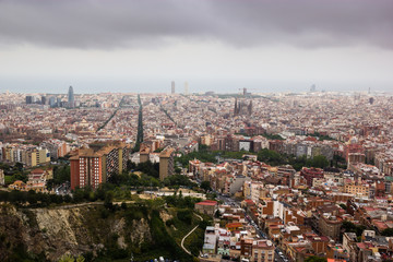 Cloudy view on Barcelona city from the mountain