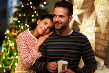 Fototapeta premium Christmas couple at home in Winter