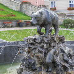 Fountain with bear and bear cubs on market in Przemysl. Bear is a symbol of city - obrazy, fototapety, plakaty