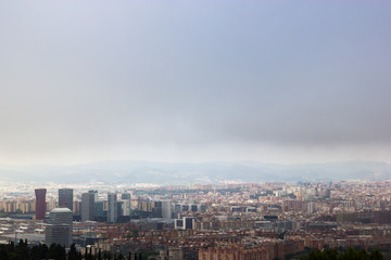 View on the Barcelona cloudy city from the Montjuic hill