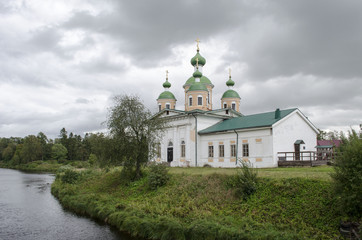 Fototapeta na wymiar Smolensky Cathedral of Olonets located on a small island Mariam, lying below the confluence of the rivers Olonka and Megregi in Karelia Russia