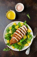 Grilled chicken breast with pineapple and arugula