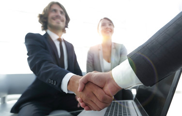 Two confidence businessman shaking hands close-up