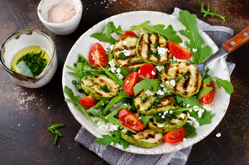 Grilled zucchini with arugula, tomatoes and cottage cheese
