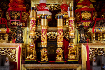 Altar in chinese shrine with wooden sculpture.