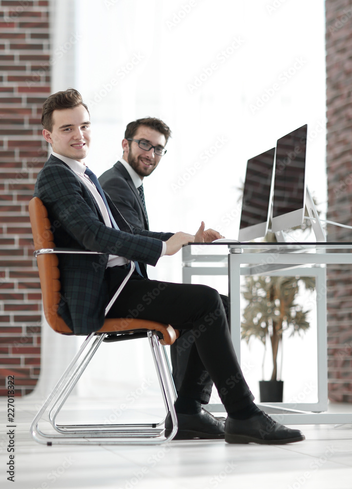 Canvas Prints young Manager at his Desk.