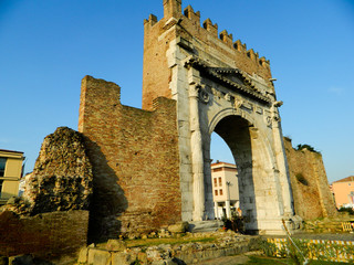 Fototapeta na wymiar Augustus arch in Rimini - ancient romanesque gate of the city - historical landmark of Italy, The historic and famous Arch of Augustus.