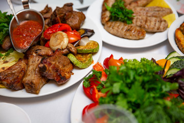 the barbecue with sauce and fresh vegetables