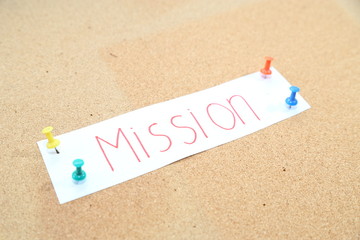 a piece of business mission paper with paper pin