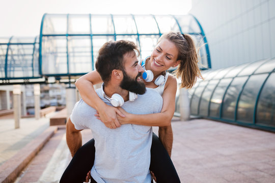 Portrait of young attractive happy fitness couple