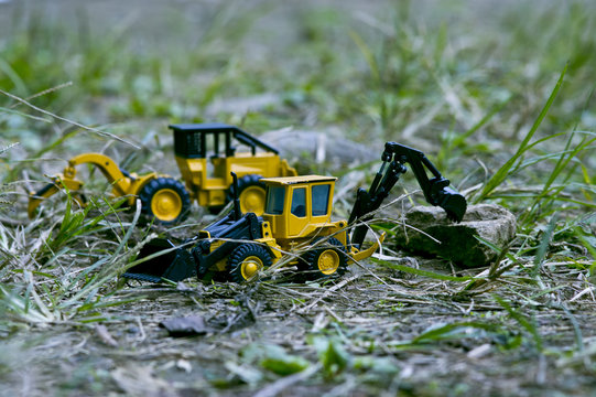 Two excavator cars that organize around to make way.