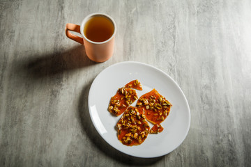Obraz na płótnie Canvas green tea and pumpkin seeds in caramelized sugar dessert