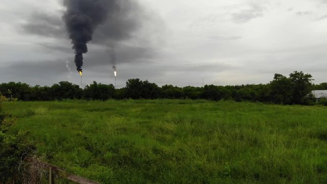 Chemical Plant Conducting Controlled Flaring to Burn Off Excess Materials in Channelview near Houston, Texas Filmed by Drone