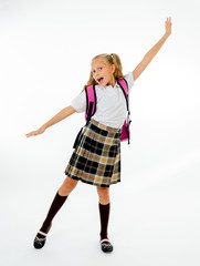 Happy funny cute primary student girl with backpack jumping and having fun