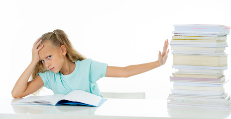 Sweet little schoolgirl feeling exhausted and stress by load of homework and schoolwork