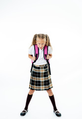 Cute unhappy schoolgirl with backpack feeling angry and frustrated