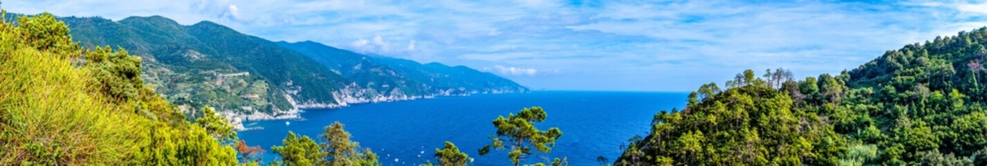 Fototapeta na wymiar Panoramic view of mountains and ocean bay in Monterosso Al Mare village Italy
