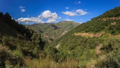 Fototapeta na wymiar Panoramic view of the mountain range in the North Caucasus in Russia.