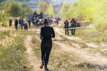Obraz premium Woman running a marathon in nature 