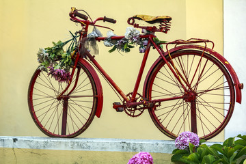 Red bicycle with flowers