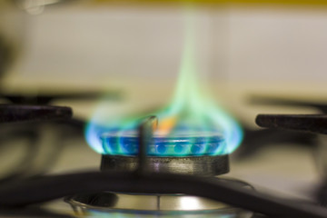 Green flame from a kitchen gas stove