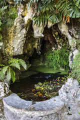 Water falling on small cave