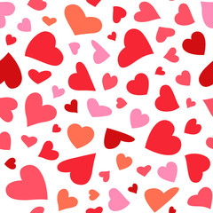 Seamless pattern with flying hearts in different colors