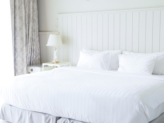 Fototapeta na wymiar Comfortable white bed