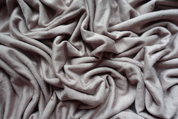 Pleats of simple grey viscose fabric from above