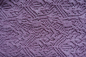 Thin pink handmade knitted lace from above