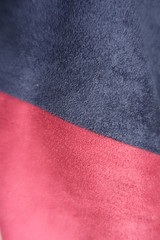 Artificial suede in dark blue and red sewn together