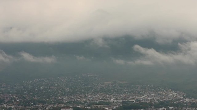 Heavy gray clouds over city in Mexico