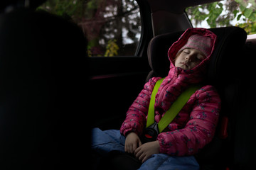 Kid sleeping on back seat