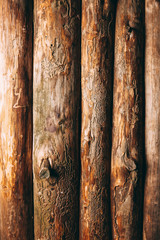 full frame of brown logs as wooden background
