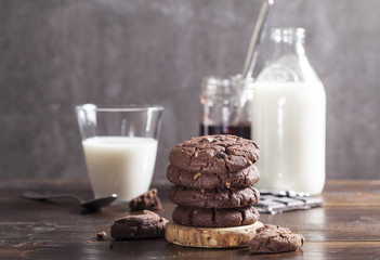 Chocolate cookies are on the wooden table.