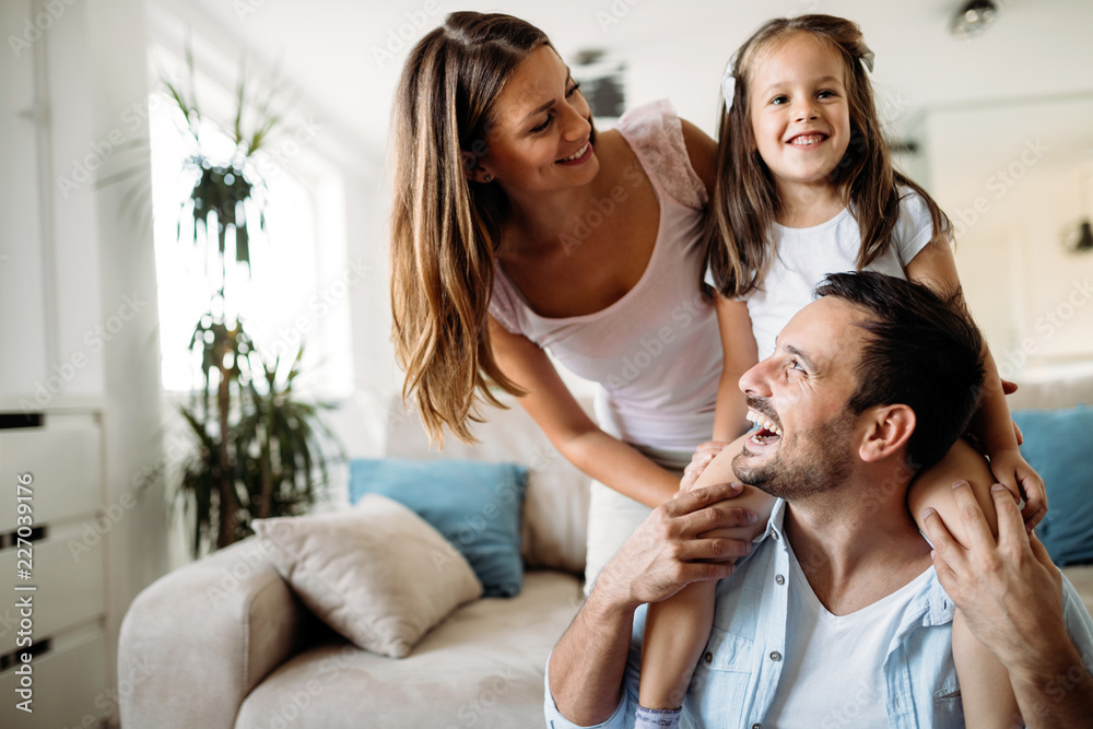 Wall mural Happy family having fun time at home