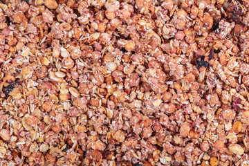 Organic homemade Granola Cereal with oats and almond. Texture oatmeal granola or muesli as background.